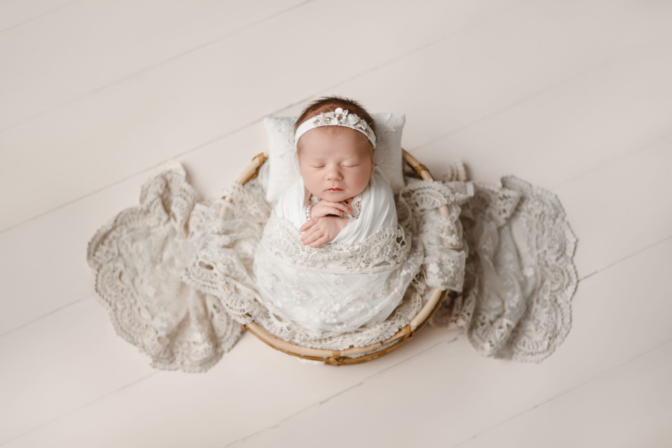 Newborn Girl with lace swaddle